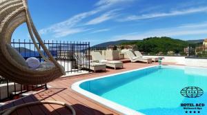 a hammock and a swimming pool on a roof at Wellness & Spa Hotel ACD Annex in Herceg-Novi