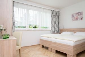 Postel nebo postele na pokoji v ubytování Gasthaus zur Waldschenke