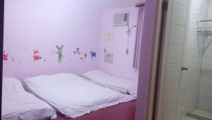 Postel nebo postele na pokoji v ubytování Dragon House B&B
