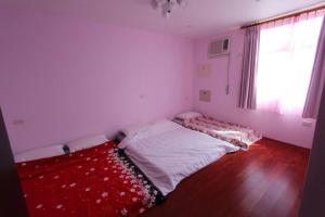 Postel nebo postele na pokoji v ubytování Dragon House B&B