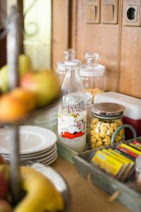 a kitchen counter with a bottle of milk and some food at Gasthaus zur Waldschenke in Zeltweg