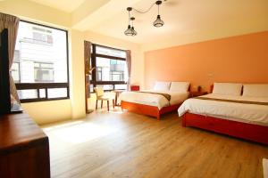Postelja oz. postelje v sobi nastanitve Yilan B&B - Happy Snail