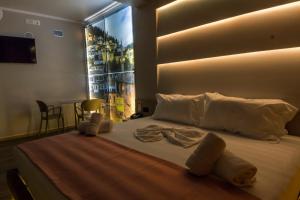 Postel nebo postele na pokoji v ubytování Hotel Pandora Residence + 37 fotografií