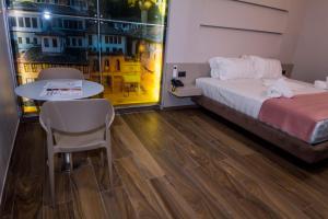 Postel nebo postele na pokoji v ubytování Hotel Pandora Residence