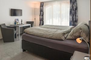 Postel nebo postele na pokoji v ubytování A Calm & Charm Studio - Haus Haro