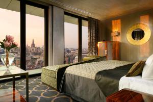 A bed or beds in a room at Uptown Palace