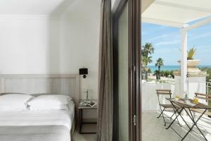 Кровать или кровати в номере Canne Bianche Lifestyle Hotel