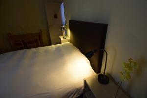 Posteľ alebo postele v izbe v ubytovaní Arahova Pansion