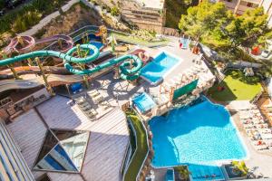 an overhead view of a water park with a water slide at Magic Aqua Rock Gardens in Benidorm