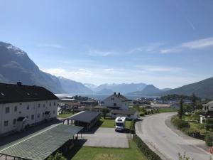 a view of a town with mountains and a road at Åndalsnes gustehouse in Åndalsnes