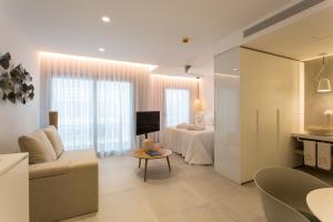 TV a/nebo společenská místnost v ubytování Sa Pedrera Suites & Spa