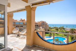 a balcony with a view of the ocean at Ático Playa de los Álamos in Torremolinos