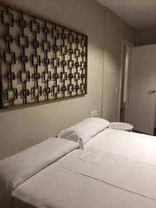 A bed or beds in a room at Mares - Bellamar