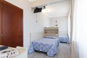Postel nebo postele na pokoji v ubytování Albergo Battelli Only Adults