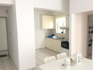 Virtuvė arba virtuvėlė apgyvendinimo įstaigoje Korona Beach Apartments II