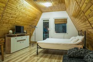 En eller flere senger på et rom på Jázmin Weekend House