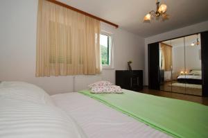 Voodi või voodid majutusasutuse Rooms Leda toas