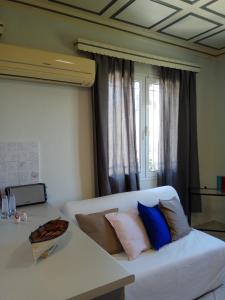 A bed or beds in a room at Monte Caputo Holiday House