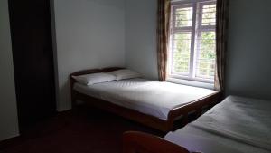 En eller flere senge i et værelse på StaySimple Spicefarm