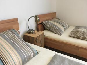 Łóżko lub łóżka w pokoju w obiekcie Pension Andante