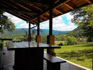 a picnic table with a view of the mountains at Private place, Boca in Bihać