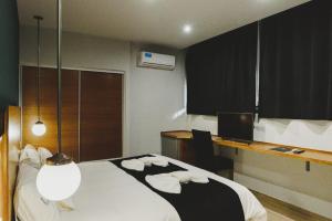 Cama ou camas em um quarto em Plaza Paradiso Petit Hotel