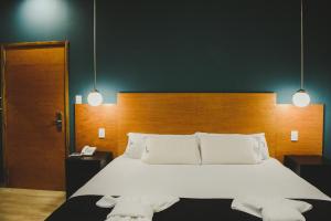 Cama ou camas em um quarto em Plaza Paradiso Petit Hotel