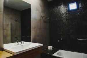 Um banheiro em Plaza Paradiso Petit Hotel