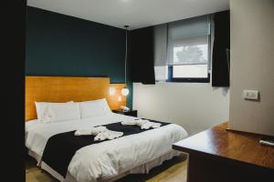 Cama ou camas em um quarto em Plaza Paradiso Petit Hotel