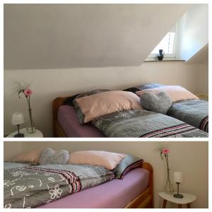 ブライにあるFewo Elfriedes Maisonetteのベッドルーム1室(ベッド2台付)の写真2枚