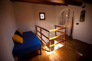 a bedroom with a bed and a stair case at Antiche scale in Castellammare del Golfo