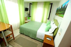 Letto o letti in una camera di Hotel Kaduku