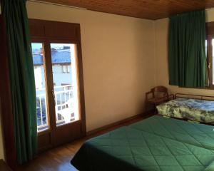Uma cama ou camas num quarto em Hotel Bon Repos