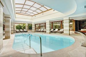 a swimming pool in a house with a ceiling at Grupotel Nilo & Spa in Paguera