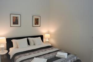 Łóżko lub łóżka w pokoju w obiekcie Apartamenty Jantar