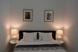 Łóżko lub łóżka w pokoju w obiekcie Apartamenty Jantar