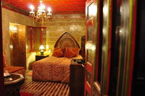 Postel nebo postele na pokoji v ubytování Riad La Maison Verte
