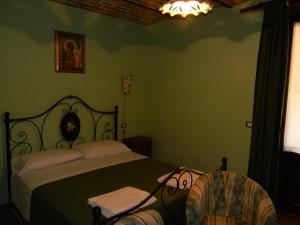 Postel nebo postele na pokoji v ubytování Azienda Agrituristica Colle San Giorgio
