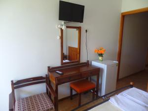 Postel nebo postele na pokoji v ubytování Hotel Inomaos