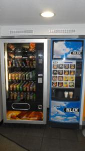 a vending machine with food and drinks in a store at hotelF1 Blois in Blois