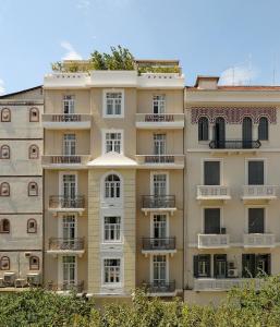 an apartment building with balconies on the side of it at The Modernist Thessaloniki in Thessaloniki