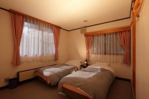 Ένα ή περισσότερα κρεβάτια σε δωμάτιο στο Piremon