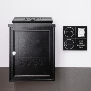 a black box with the words post on a wall at The Modernist Thessaloniki in Thessaloniki