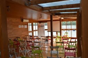 a room filled with lots of chairs and tables at ArkaBarka 2- Floating Dream Rooms and Apartments in Belgrade