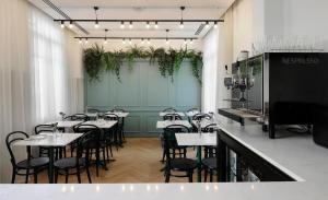 a row of tables and chairs in a restaurant at The Modernist Thessaloniki in Thessaloniki