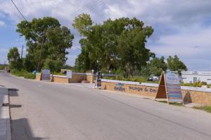 an empty street with a sign on the side of the road at Argilos in Sidari