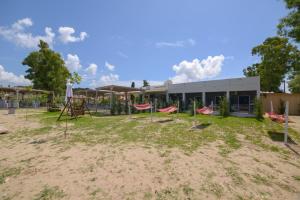 an empty playground in front of a building at Argilos in Sidari