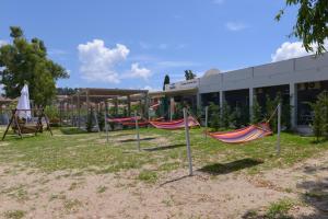 a group of hammocks in front of a building at Argilos in Sidari