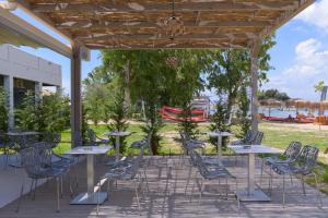 a group of tables and chairs on a patio at Argilos in Sidari
