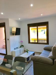 Μια τηλεόραση ή/και κέντρο ψυχαγωγίας στο Levante Apartment by Albir Proper Properties